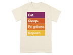 Cream t-shirt with "Eat. Sleep. Pet goldens. Repeat." in colorful blocks.
