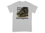 Gray t-shirt with "Every Walk Is an Investigation" text and dog wearing a hat.