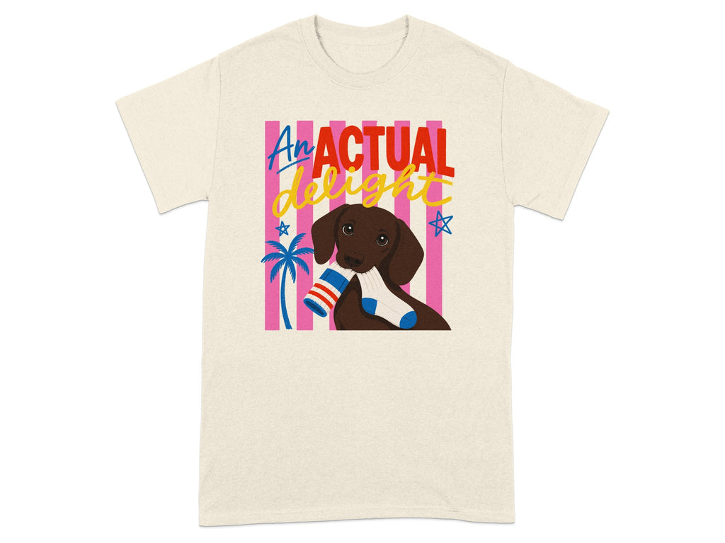 Cream t-shirt with a brown dog holding socks and "An Actual Delight" text.
