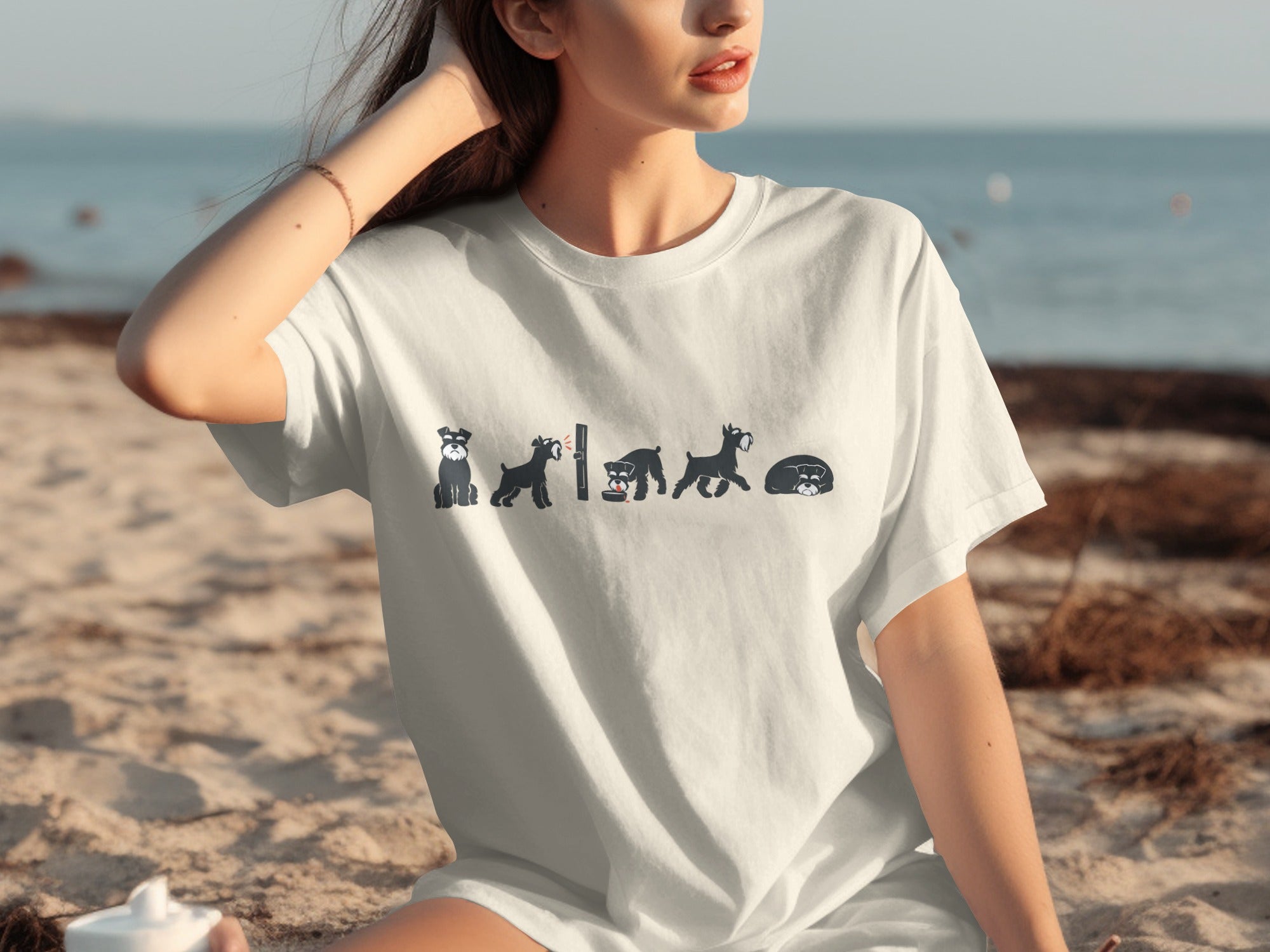 White t-shirt with minimalist black schnauzer illustrations in various poses.