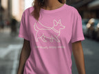 Pink t-shirt with line drawing of a dog and text "Slow down, enjoy walks".