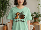 Mint green t-shirt with beagle and coffee cup graphic that reads "POWERED BY BEAGLE & COFFEE".