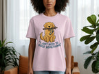 Pink t-shirt with graphic of a cartoon dog holding a stick.