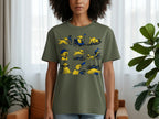 Olive green shirt with a cartoon of a yellow dog's cycling adventures.