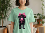 T-shirt with black dog wearing sunglasses, pink bow, and blowing pink bubblegum.