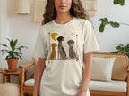 T-shirt with a graphic of three stylized dogs sitting in a line.