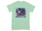Light green t-shirt with watercolor dog art and "Unleash the Joy" text.