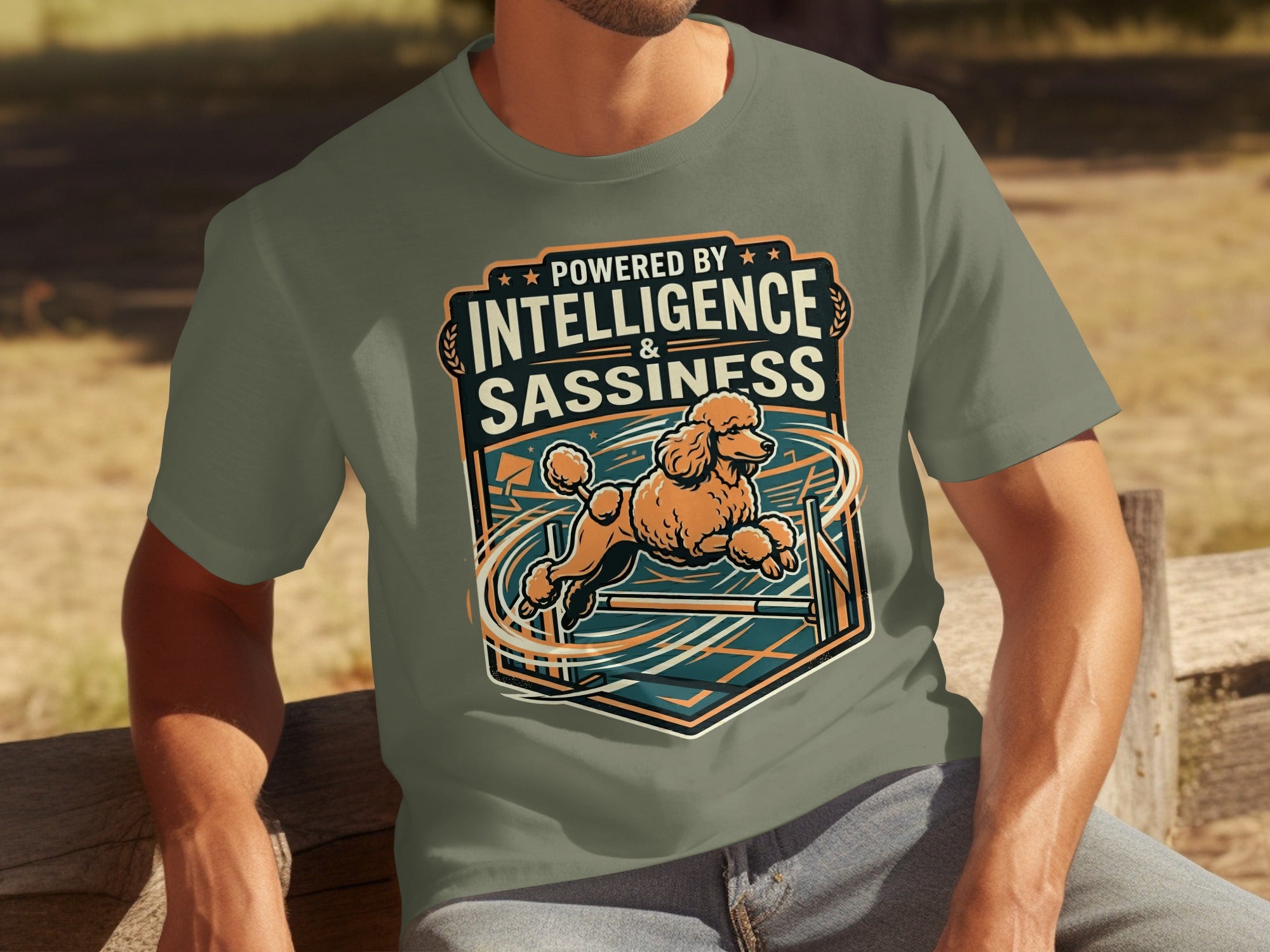 T-shirt graphic of a poodle jumping over an obstacle, with text "Powered by Intelligence & Sassiness".