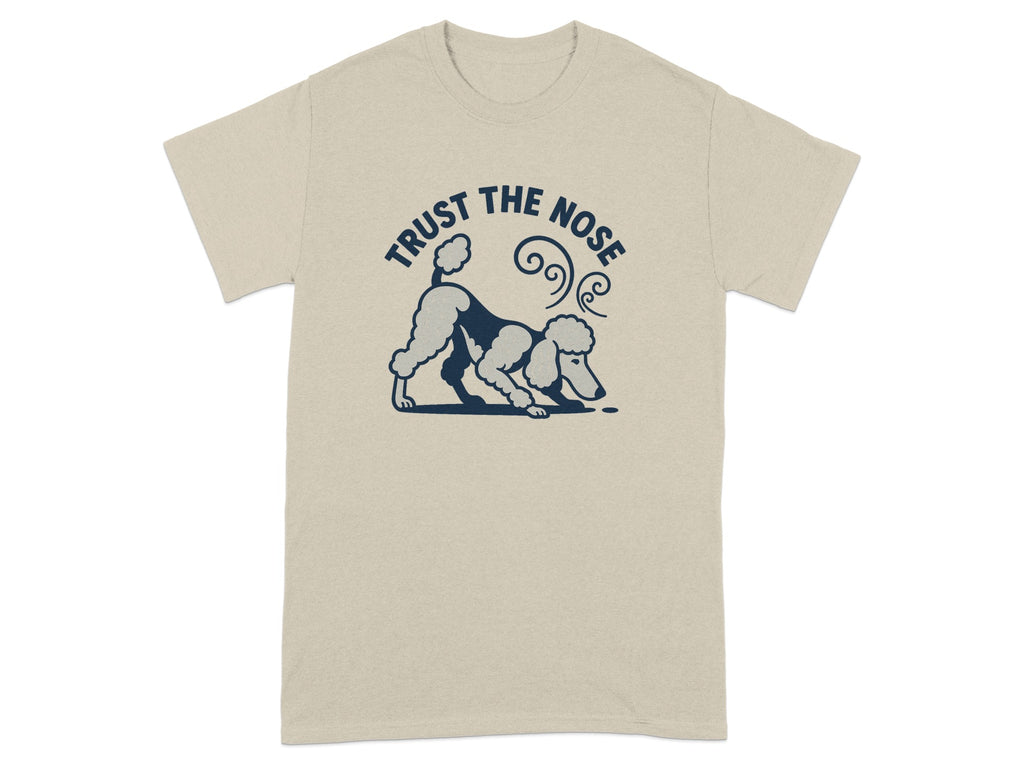 Tan t-shirt with navy graphic of a poodle sniffing the ground with text "TRUST THE NOSE".