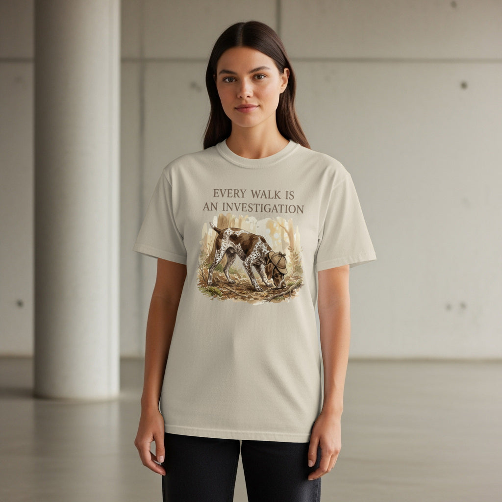 T-shirt with a German Shorthaired Pointer investigating a wooded area.