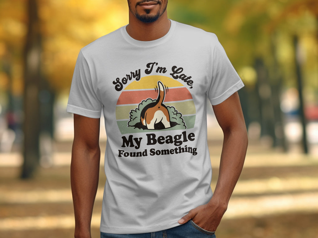 White t-shirt with cartoon beagle diving into ground, text "Sorry I'm Late, My Beagle Found Something."