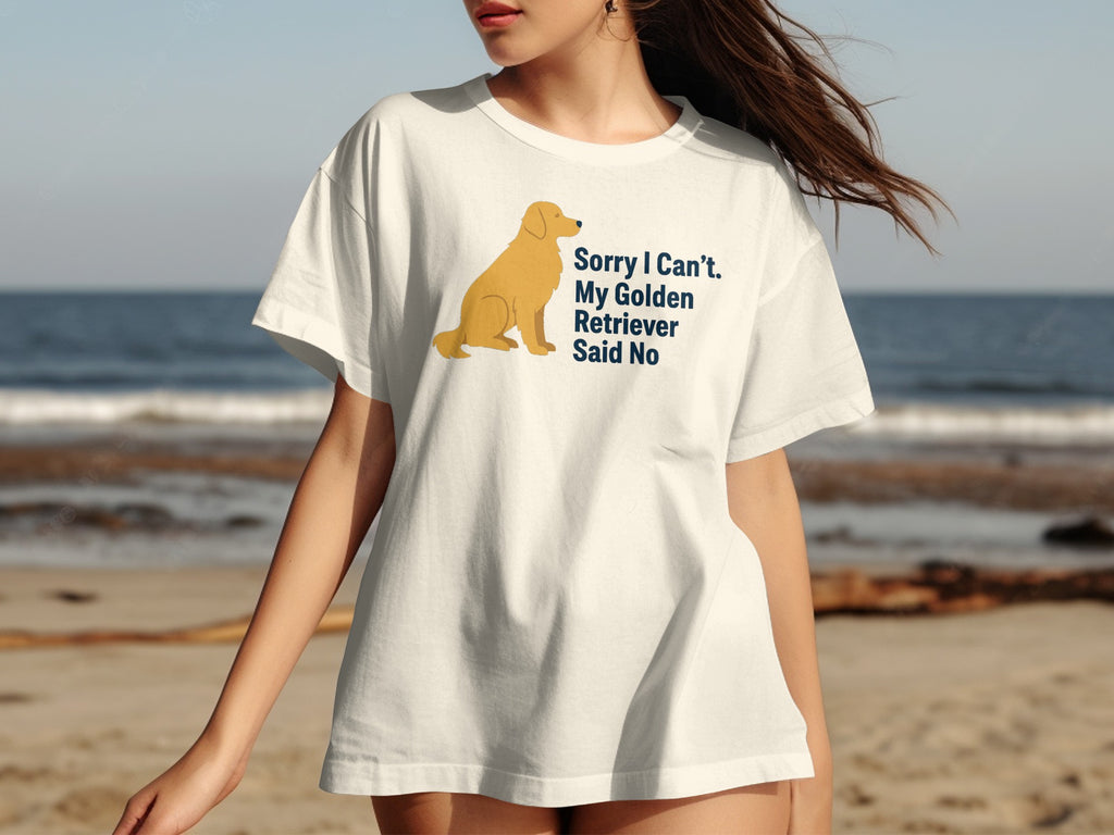 White t-shirt with graphic of a golden retriever and text "Sorry I Can't. My Golden Retriever Said No".