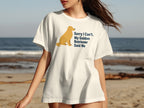 White t-shirt with graphic of a golden retriever and text "Sorry I Can't. My Golden Retriever Said No".