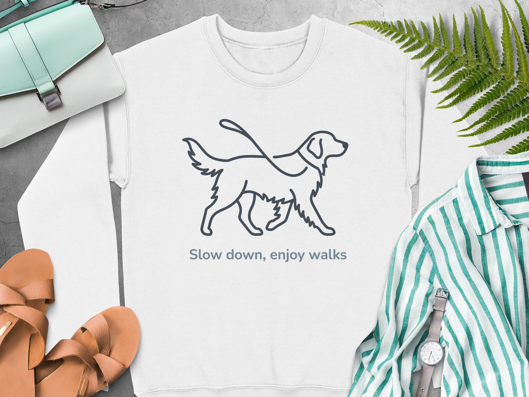 Line art of a dog on a leash with text "Slow down, enjoy walks."