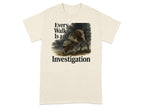 T-shirt with dog wearing detective hat and text "Every Walk Is an Investigation".