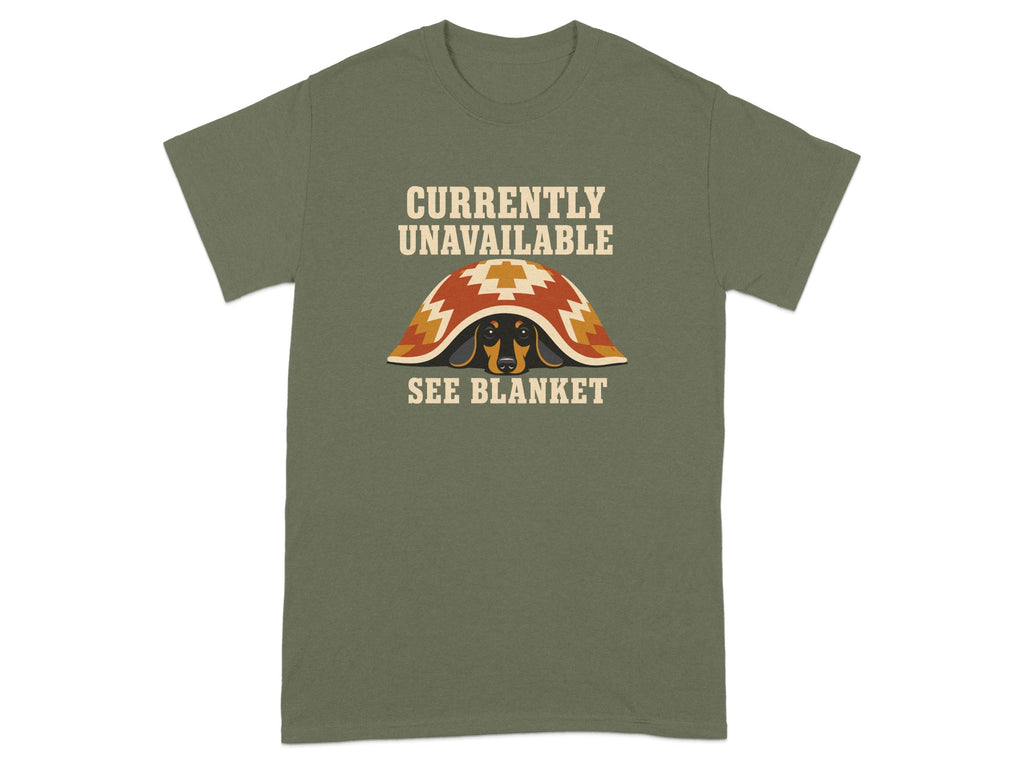 Green t-shirt with dachshund under a patterned blanket, text "CURRENTLY UNAVAILABLE SEE BLANKET".
