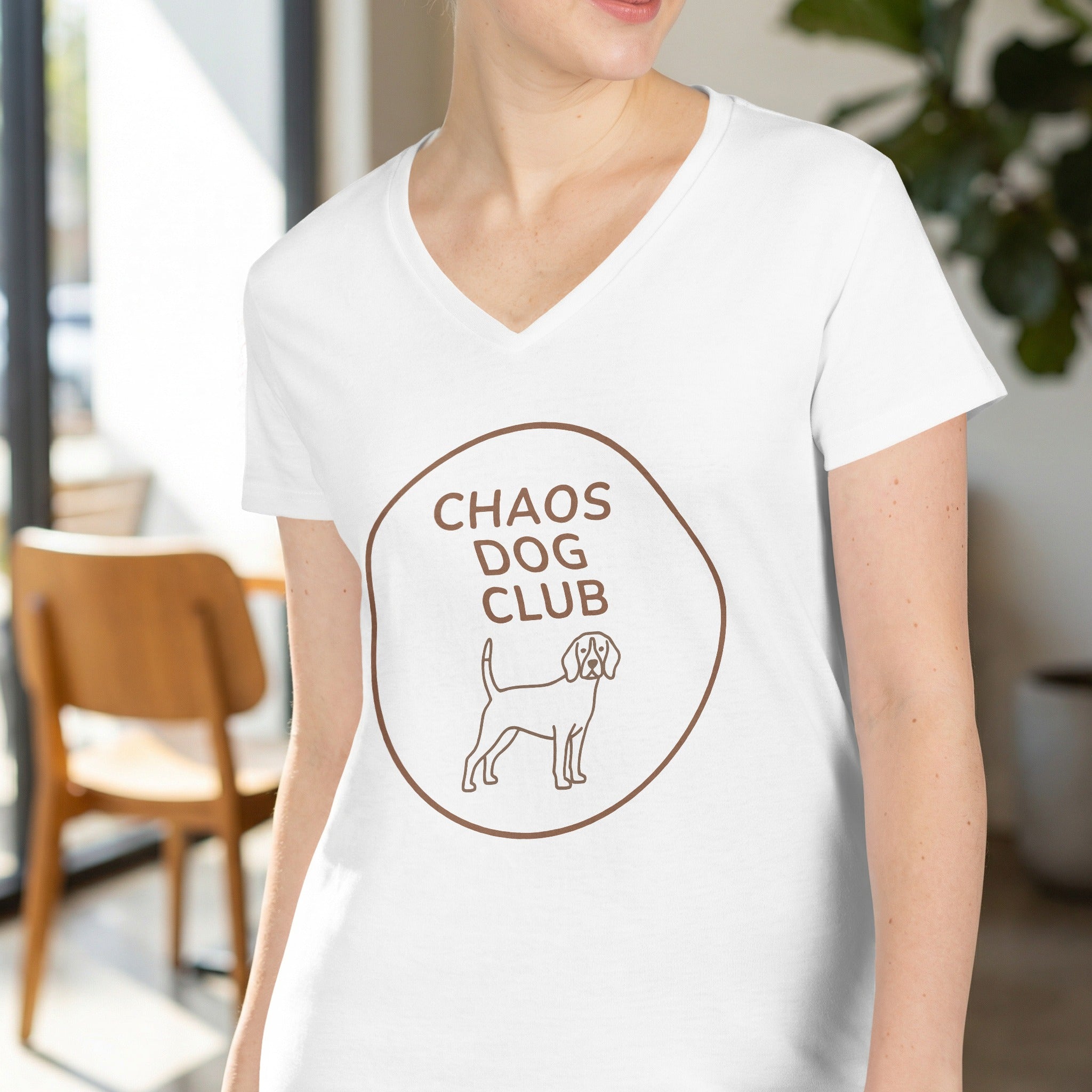 White v-neck t-shirt with brown "Chaos Dog Club" text and beagle graphic.