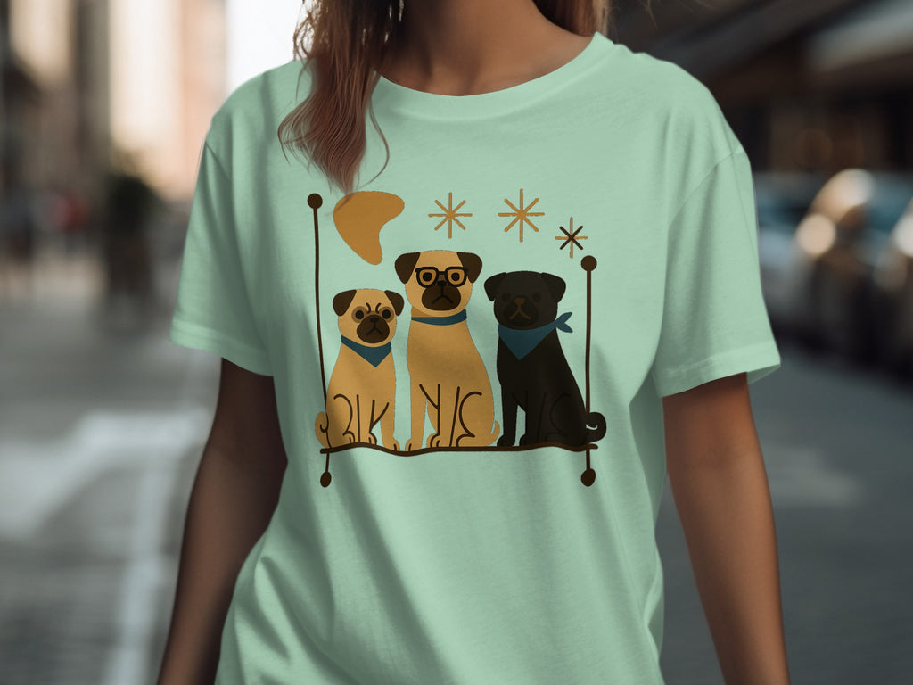 Three pugs, one wearing glasses, sit on a shelf with decorative stars and a crescent.