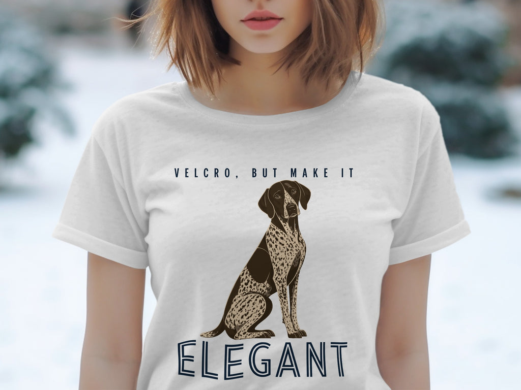 White t-shirt with dog illustration and text "VELCRO, BUT MAKE IT ELEGANT".