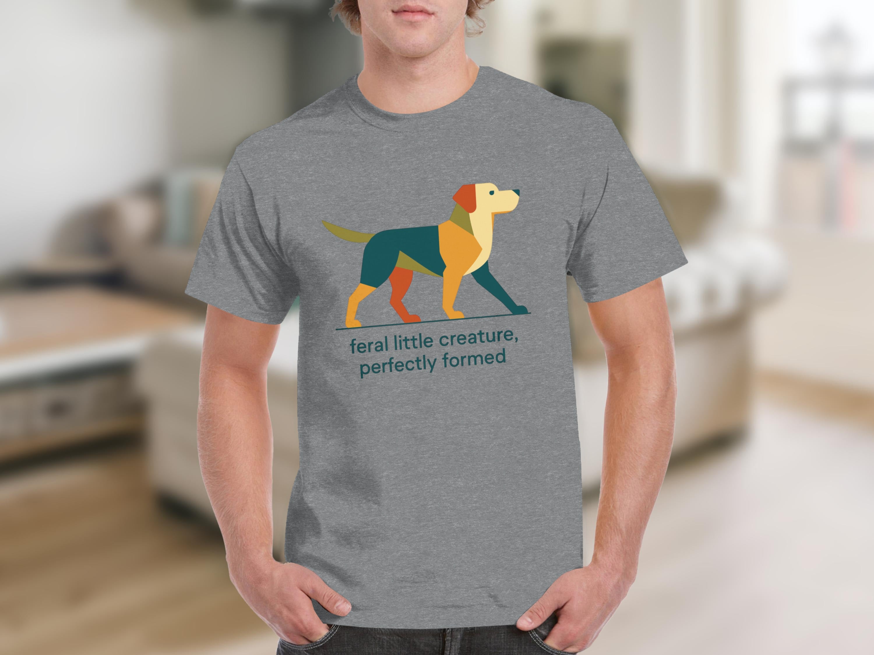 Grey t-shirt with abstract dog art and text "feral little creature, perfectly formed".
