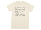 Cream t-shirt with "CAUTION: may start talking about my dog's ZOOMIES" and a dog silhouette.
