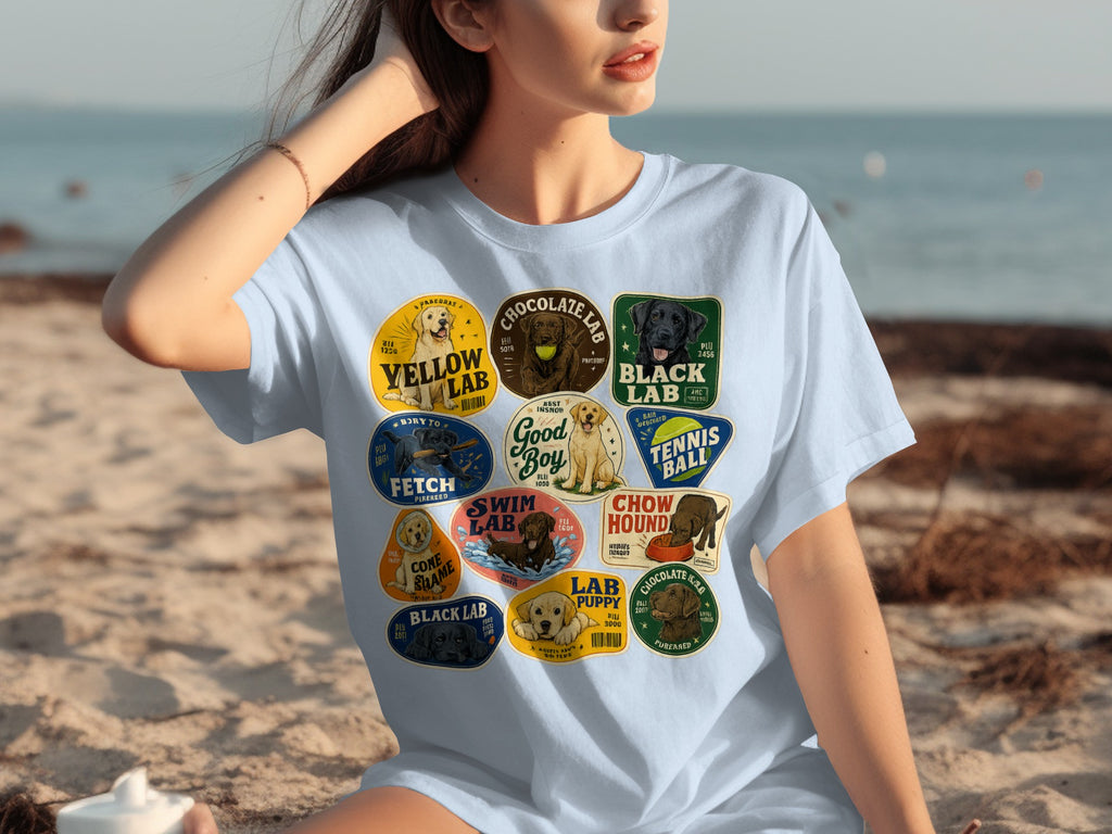 Light blue t-shirt with collage of various Labrador Retriever breed patches.