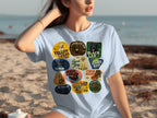 Light blue t-shirt with collage of various Labrador Retriever breed patches.