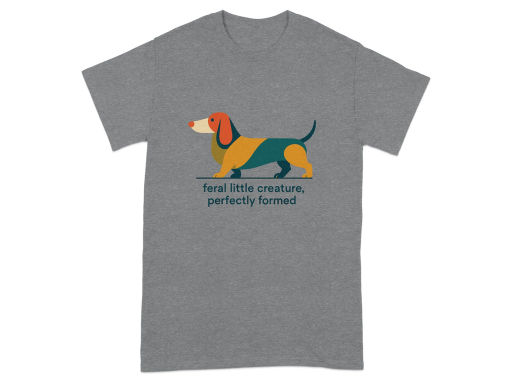 Grey t-shirt with a colorful illustrated dachshund and text that reads "feral little creature, perfectly formed".