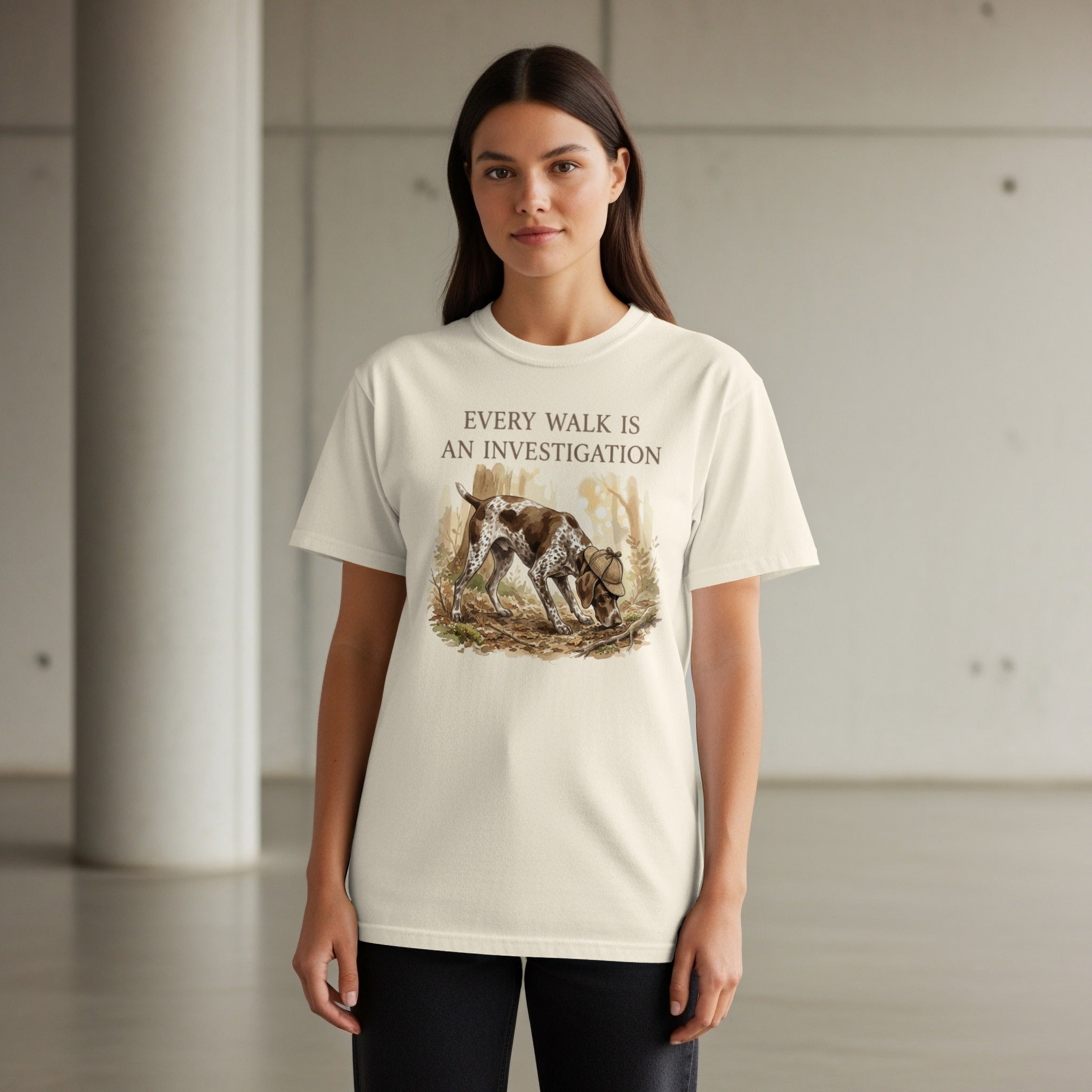 Woman wearing cream t-shirt with German Shorthaired Pointer illustration and text.