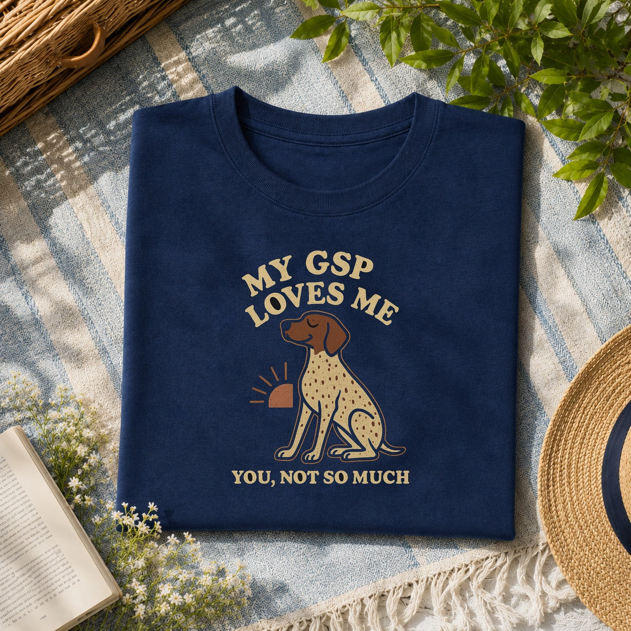 My German Shorthaired Pointer loves me tee on a navy shirt, folded flat lay