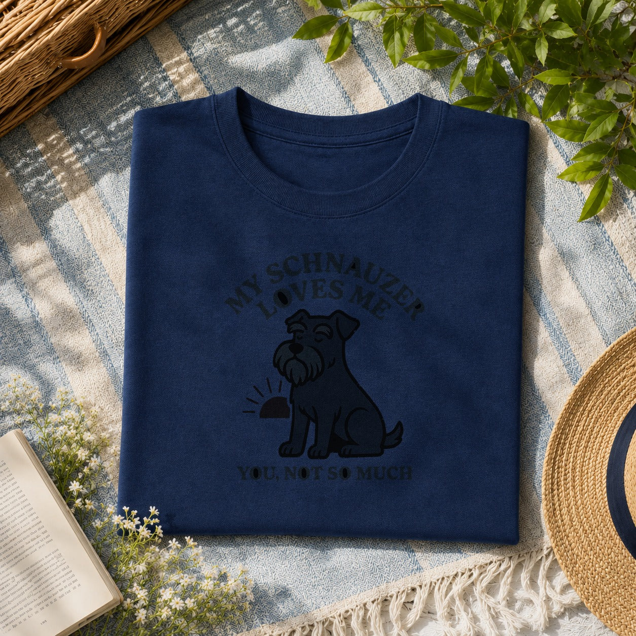 My Schnauzer loves me tee on a navy shirt, folded flat lay