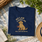 My yellow lab loves me tee on a navy shirt, folded flat lay